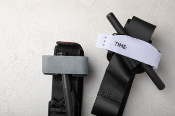 Medical tourniquet to stop the blood on a white textured background. Place to copy. flat lay.