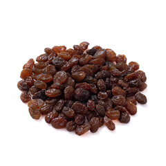 a pile of dark raisins lies isolated on a white background