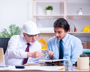 Two architects working on the project