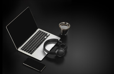 Workspace mockup template on black structural background. Musician composer workplace with headphones, laptop, phone and cup of coffee