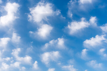 Background of white clouds in a blue sky, clouds leaving traces by the action of the wind.