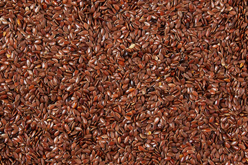 Heap flax seeds. Texture background.
