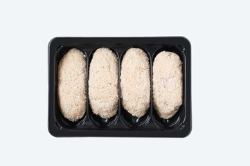Meat cutlets black plastic packaging. White isolate.