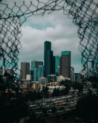 city skyline tough hole in the fence