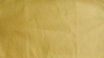 yellow fabric background with dots. jute bag texture.