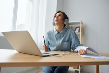 Upset angry tired call center operator curly awesome lady experiencing professional burnout working from home online communication with clients. Young woman hates her work need psychological help. 