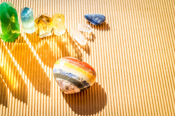 Healing crystals on brown background