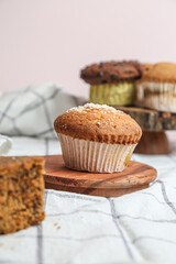 Chocolate muffin and walnut muffin, homemade bakery on dark background