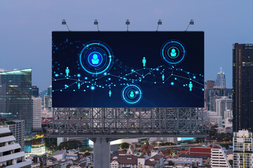 Glowing Social media icons on billboard over sunset panoramic city view of Bangkok. The concept of networking and establishing new connections between people and businesses in Southeast Asia