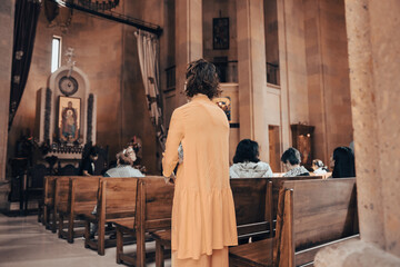 people praying sitting in the church