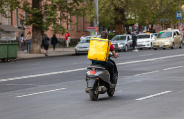 Naklejka na ściany i meble bicycle delivery worker in street