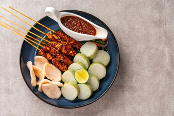 Sate Kacang or Chicken satay is Indonesian traditional Food skewered with grilled meat and rice...