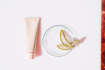 Glass petri dish with transparent pure serum for skin care