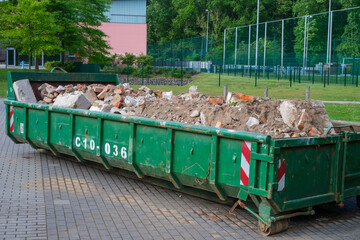 in some large containers there is the waste from a house demolition
