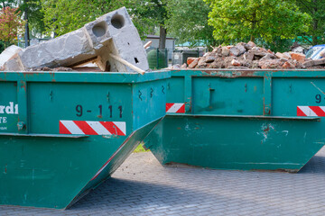 in some large containers there is the waste from a house demolition