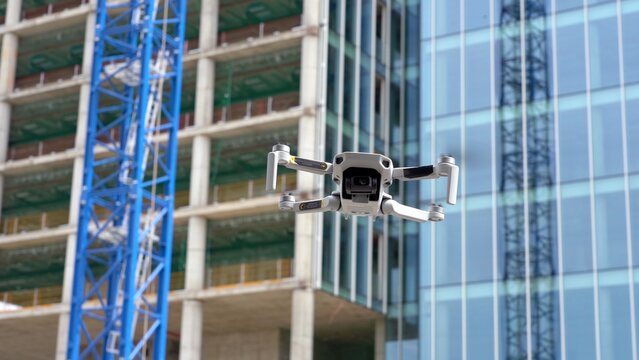 use the drone for surveys and measurements to create a 3d virtual reality model of the building -  the drone in construction site works -  new technology and real estate video and photo