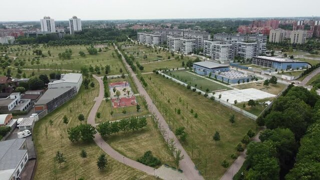 Drone view of Sei Milano, new GARDEN CITY  in the western suburbs near Bisceglie subway. Urban regeneration project and green revolution - building site and gru for the new skyline and skyscrapers 