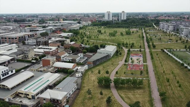 Drone view of Sei Milano, new GARDEN CITY  in the western suburbs near Bisceglie subway. Urban regeneration project and green revolution - the park near the new skyscrapers site 