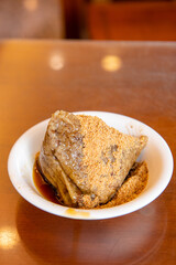 rice dumpling is a traditional Chinese rice dish made of glutinous rice and wrapped in bamboo leaves,