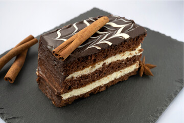 Chocolate cake with cinnamon and sour cream. on the table. Homemade chocolate cake
