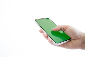 green screen on phone in woman hand, mockup, chroma key