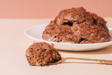 Piece of cake on cake fork on plate opposite.