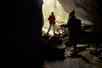 Fototapeta premium Young people having active journey in the forest