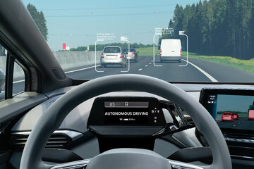 Autonomous car with head up display on a road. Inside view.	