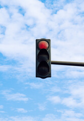 Red traffic light on the street