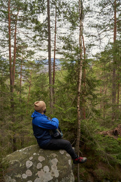 Relaxed male person looking upwards at the sky