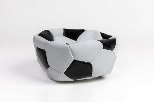 Deflated Soccer Ball on White Background