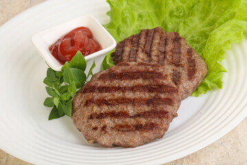 Grilled beef burger cutlet with sauce