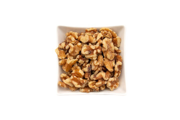 A white bowl with nuts. Isolated on white background. Nuts are available in two forms, shell or shelled, and can be whole, halved, or in smaller portions due to processing. 