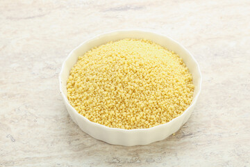 Raw couscous in the bowl