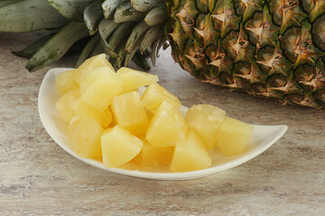 Marinated pineapple slices in the bowl