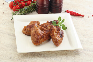 Roasted chicken wings with spicy sauce