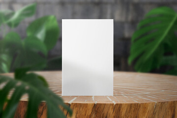 Clean minimal book 4x6 mockup on timber with leaves