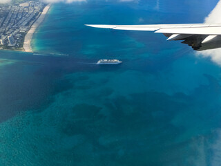 Miami from airplane porthole at day with blue sky