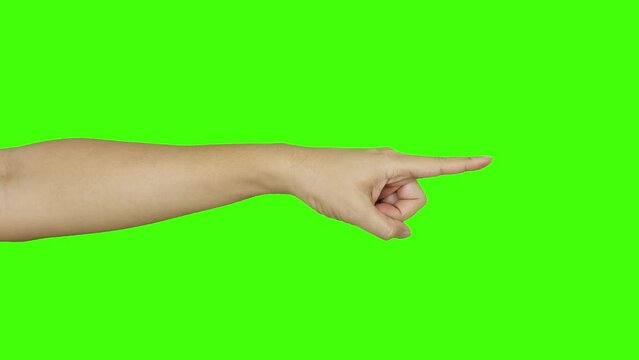 male hand pointing finger in direction green background