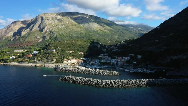 The dikes of the marina of Porto in Maratea and the Tyrrhenian Sea in Europe, Italy, Basilicata, in summer on a sunny day.