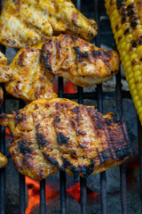 chicken meat and corn on the grill