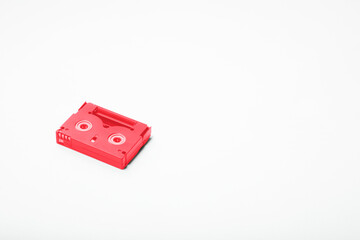 single red magnetic tape cassette  on white background