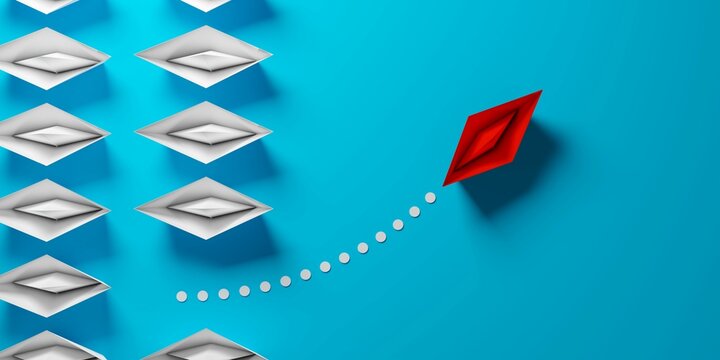 Red paper boat driving away from uniform group of white paper ships on blue background, difference or business leadership concept, flat lay top view from above