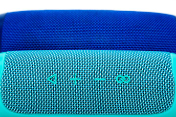 Two new wireless speakers on a white background, one turquoise and the other blue.