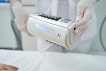 apparatus held in hands of beautician