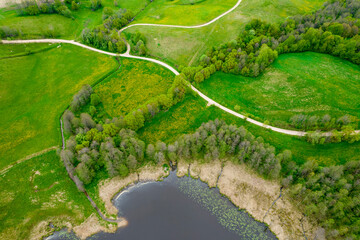 Wiejski krajobraz, widok z drona. Zielone pola na północy Polski. Suwalszczyzna wiosną. - obrazy, fototapety, plakaty