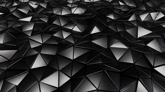 Realistic looping abstract 3D animation of the dark moving carbon fiber triangles pattern rendered in UHD as motion background