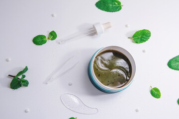 A cow resting, laying on the meadow in green grass. Farm cattle on pasture 