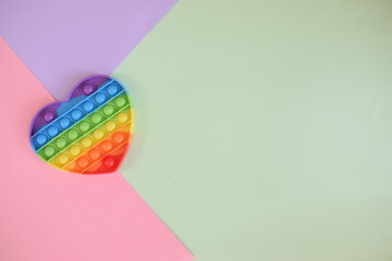 Push pop bubble sensory fidget toy stress. Background with three colors.