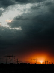 Dramatic stormy sky with orange amazing sunset gradient. Epic grey clouds, beautiful nature...